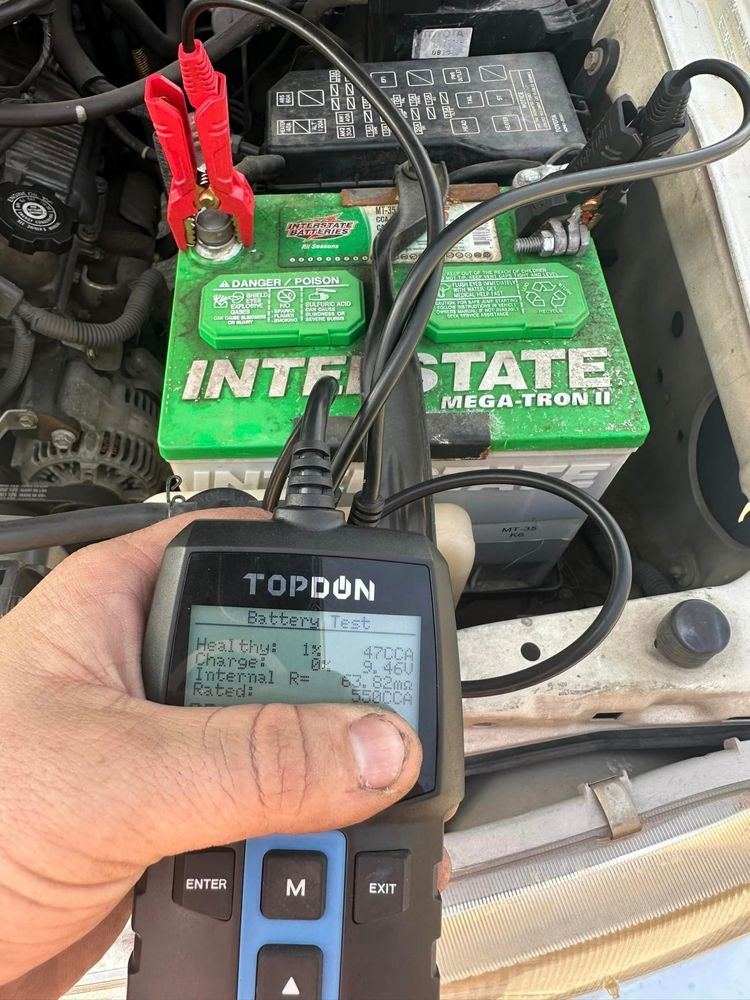 Battery tester checking a battery after a jump start