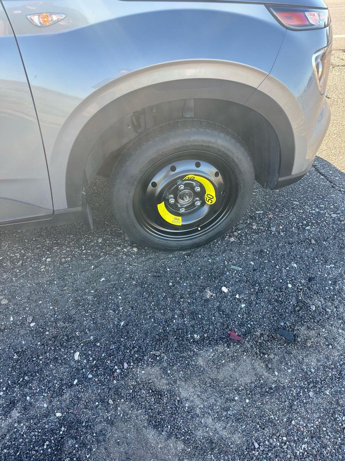 Compact spare tire installed on an SUV